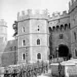 The Castle Guard, formed from members of the training battalion, Grenadier Guards, leaving the main entrance of Windsor Castle on the way to Victoria Barracks in Windsor, 30 June 1940.