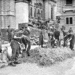 Troops from the Grenadier Guards constructing sandbag defences around government buildings in Birdcage Walk, London, May 1940.