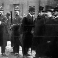 Churchill confers with an inspector during the siege.